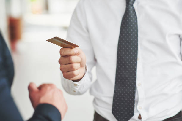 istock plastic card in the hands of a man 1124435962