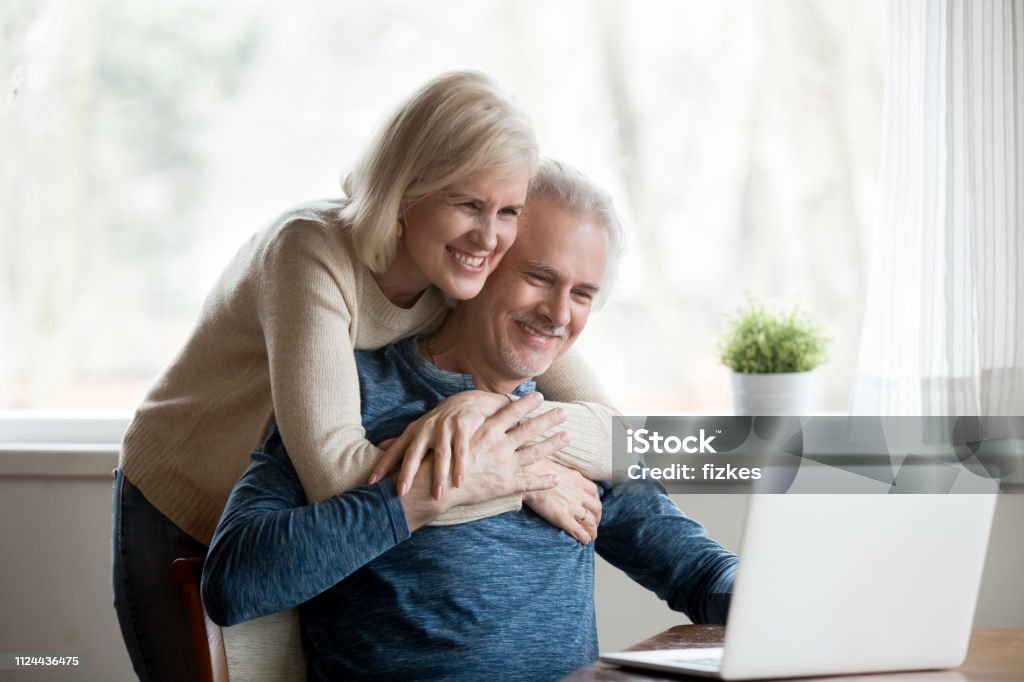 Old Spouses Watching Funny Videos Using Computer Stock Photo - Download  Image Now - Couple - Relationship, Savings, Senior Adult - iStock