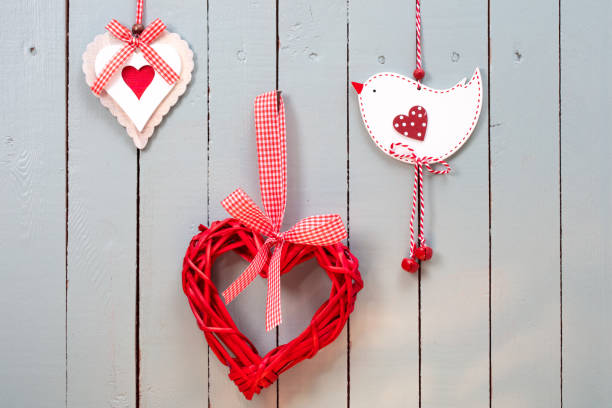Ornate handmade hearts on a gray painted wooden background. Space for copy.
