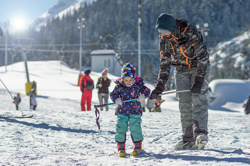 Father and daughter on skiing.