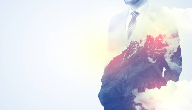 istock Businessman standing with mountain graphic 1124439487
