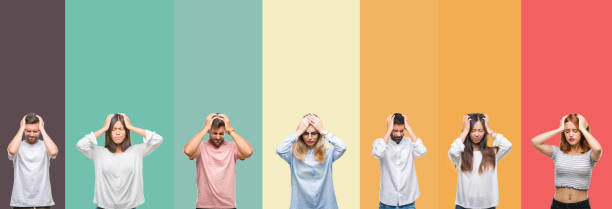 istock Collage of different ethnics young people over colorful stripes isolated background suffering from headache desperate and stressed because pain and migraine. Hands on head. 1124439970