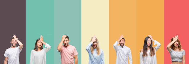 istock Collage of different ethnics young people over colorful stripes isolated background surprised with hand on head for mistake, remember error. Forgot, bad memory concept. 1124440075