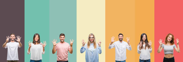 istock Collage of different ethnics young people over colorful stripes isolated background showing and pointing up with fingers number eight while smiling confident and happy. 1124441321