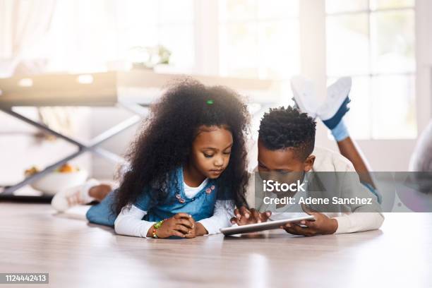 The Digital World Answers To Their Curiosity Stock Photo - Download Image Now - Child, Internet, Playful