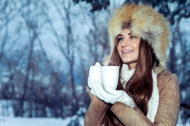 istock Woman enjoying winter holidays 1124444826