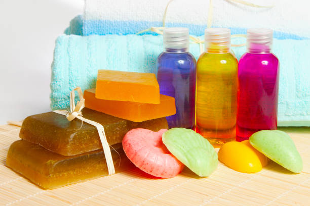 handmade soap, shampoo and shower gel with a towel - bath accessories