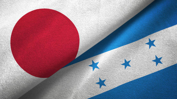 istock Honduras and Japan two flags together textile cloth, fabric texture 1124449762
