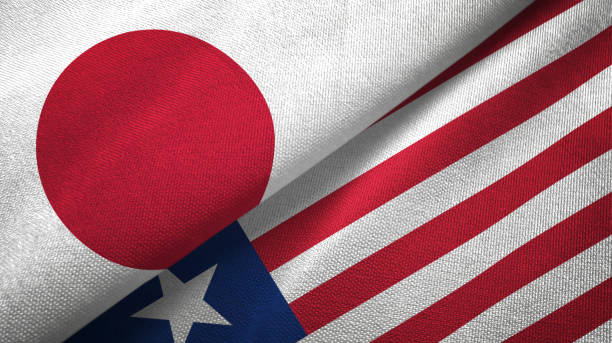 istock Liberia and Japan two flags together textile cloth, fabric texture 1124449823
