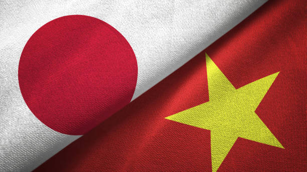 istock Vietnam and Japan two flags together textile cloth, fabric texture 1124450156