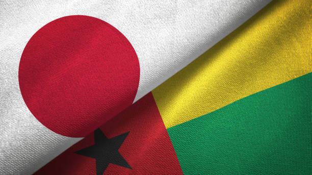 istock Guinea-Bissau and Japan two flags together textile cloth, fabric texture 1124451142