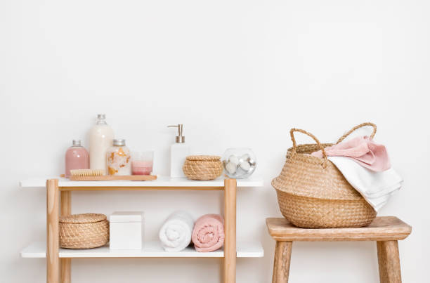 spa bathroom interior with wooden shelf, stool and skincare products - home accessories imagens e fotografias de stock