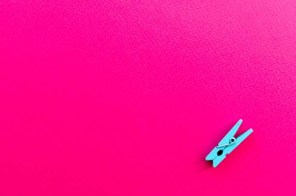 istock clothes pin on paper background 1124452529