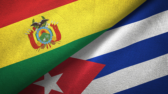 Cuba and Bolivia flags together textile cloth, fabric texture