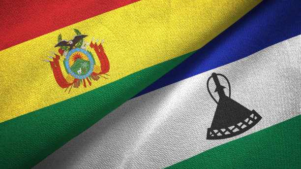 istock Lesotho and Bolivia two flags together textile cloth, fabric texture 1124456688
