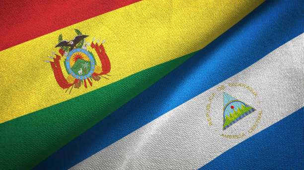 istock Nicaragua and Bolivia two flags together textile cloth, fabric texture 1124456775