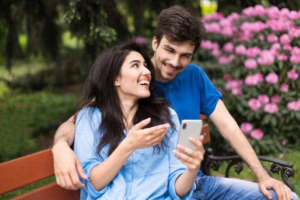 istock Happy couple in the park 1124469362