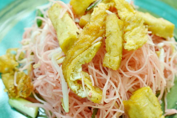 istock stir fried vermicelli with coconut milk topping tofu and slice egg 1124473356