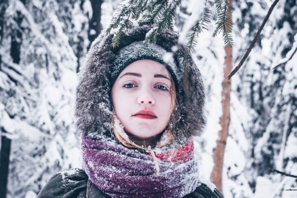istock Beautiful girl in winter forest 1124474034