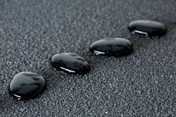 istock Stones with drops of water on a black background 1124475051