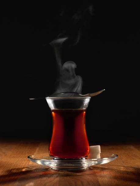 istock Hot Turkish tea with spoon and two sugars. 1124477108
