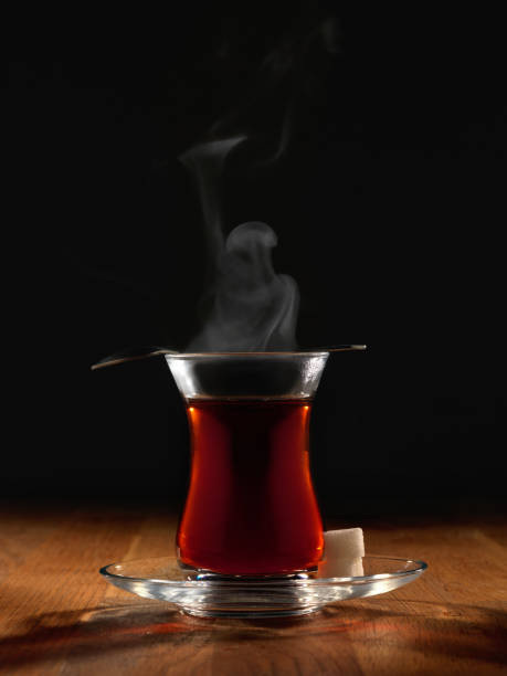istock Hot Turkish tea with spoon and two sugars. 1124477177