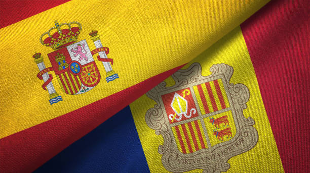 istock Andorra and Spain two flags together textile cloth, fabric texture 1124477375