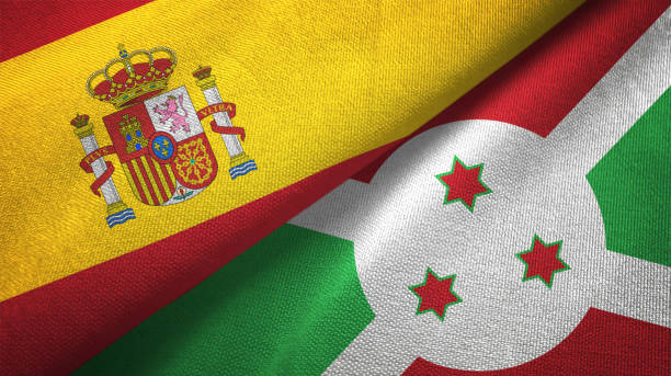istock Burundi and Spain two flags together textile cloth, fabric texture 1124477412