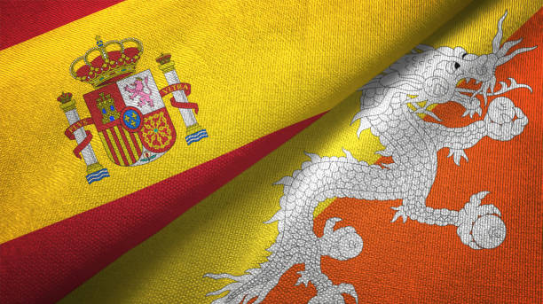 istock Bhutan and Spain two flags together textile cloth, fabric texture 1124477413