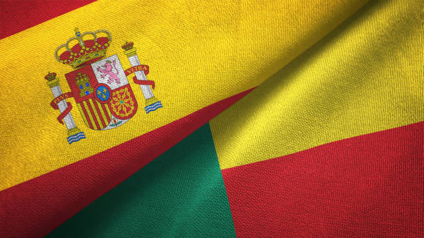 istock Benin and Spain two flags together textile cloth, fabric texture 1124477418