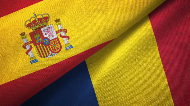istock Chad and Spain two flags together textile cloth, fabric texture 1124477450