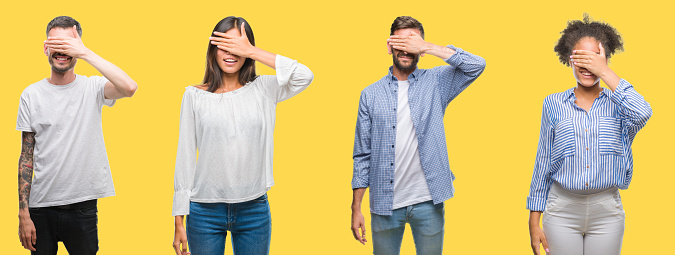 Collage of group people, women and men over colorful yellow isolated background smiling and laughing with hand on face covering eyes for surprise. Blind concept.