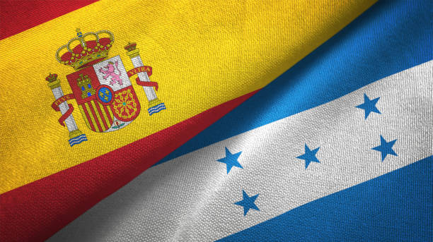 istock Honduras and Spain two flags together textile cloth, fabric texture 1124477670