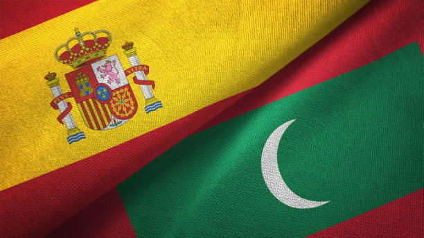 istock Maldives and Spain two flags together textile cloth, fabric texture 1124477757