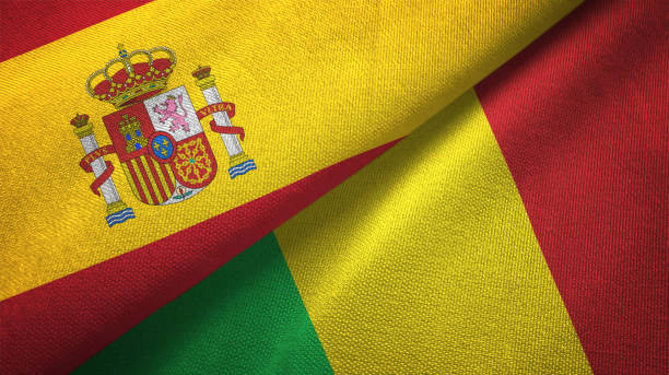 istock Mali and Spain two flags together textile cloth, fabric texture 1124477795