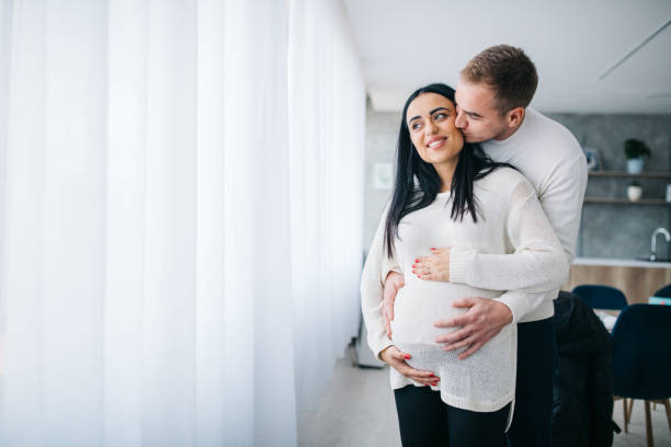 istock Parents touching pregnant belly 1124478682