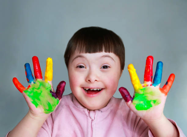 istock Cute little kid with painted hands. Isolated on grey background. 1124478716