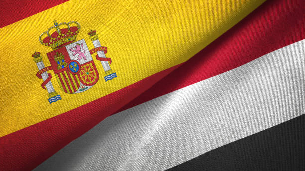 istock Yemen and Spain two flags together textile cloth, fabric texture 1124478736