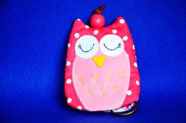istock DIY handmade key cover owl doll pattern made from colorful fabric and leather and plastic beads in workshop thai style 1124479465