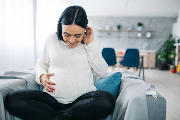 istock Pregnant woman holding her belly 1124479470