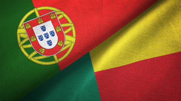 istock Benin and Portugal two flags together textile cloth, fabric texture 1124479559