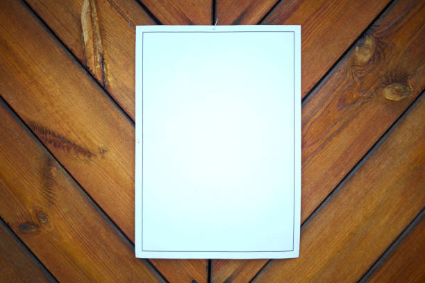 istock white paper on wood wall 1124479594