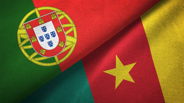 istock Cameroon and Portugal two flags together textile cloth, fabric texture 1124479610