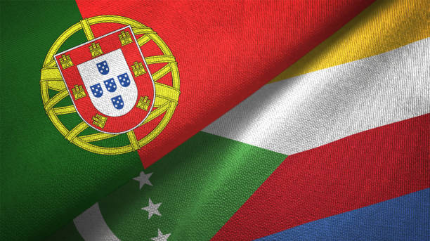 istock Comoros and Portugal two flags together textile cloth, fabric texture 1124479688