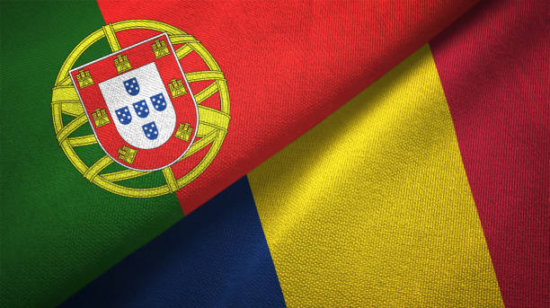 istock Chad and Portugal two flags together textile cloth, fabric texture 1124479741