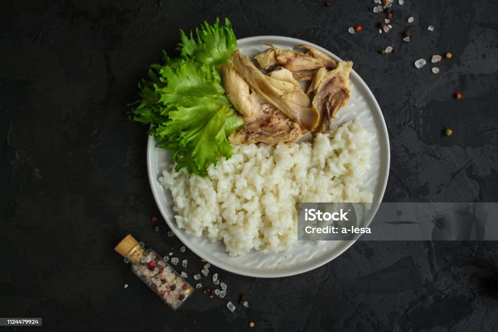 rice and boiled chicken meat. proper nutrition. food background. copy space rice and boiled chicken Advertisement Stock Photo