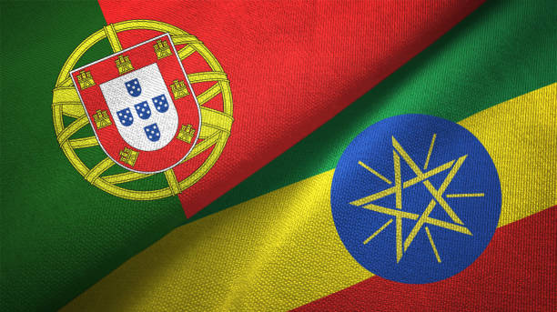 istock Ethiopia and Portugal two flags together textile cloth, fabric texture 1124479957