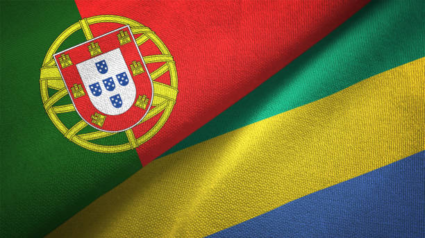istock Gabon and Portugal two flags together textile cloth, fabric texture 1124479983