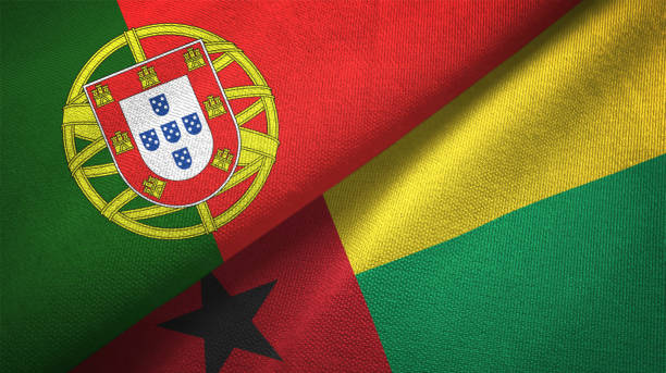 istock Guinea-Bissau and Portugal two flags together textile cloth, fabric texture 1124480128