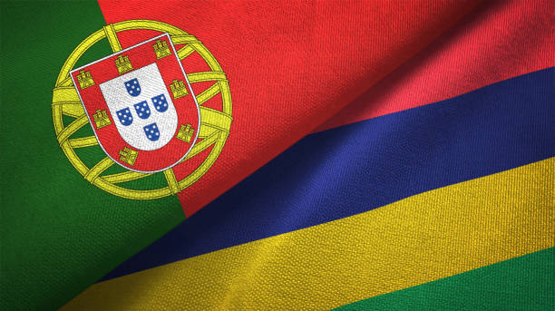 istock Mauritius and Portugal two flags together textile cloth, fabric texture 1124481013